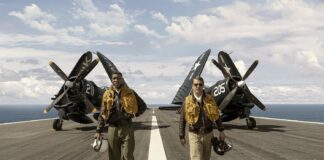 New Film ‘Devotion’ Honors US Navy’s First Black Aviator Jonathan Majors and Glen Powell in New Film Devotion
