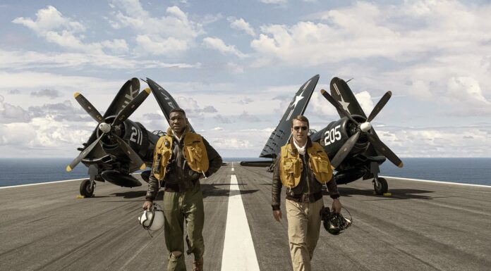 New Film ‘Devotion’ Honors US Navy’s First Black Aviator Jonathan Majors and Glen Powell in New Film Devotion
