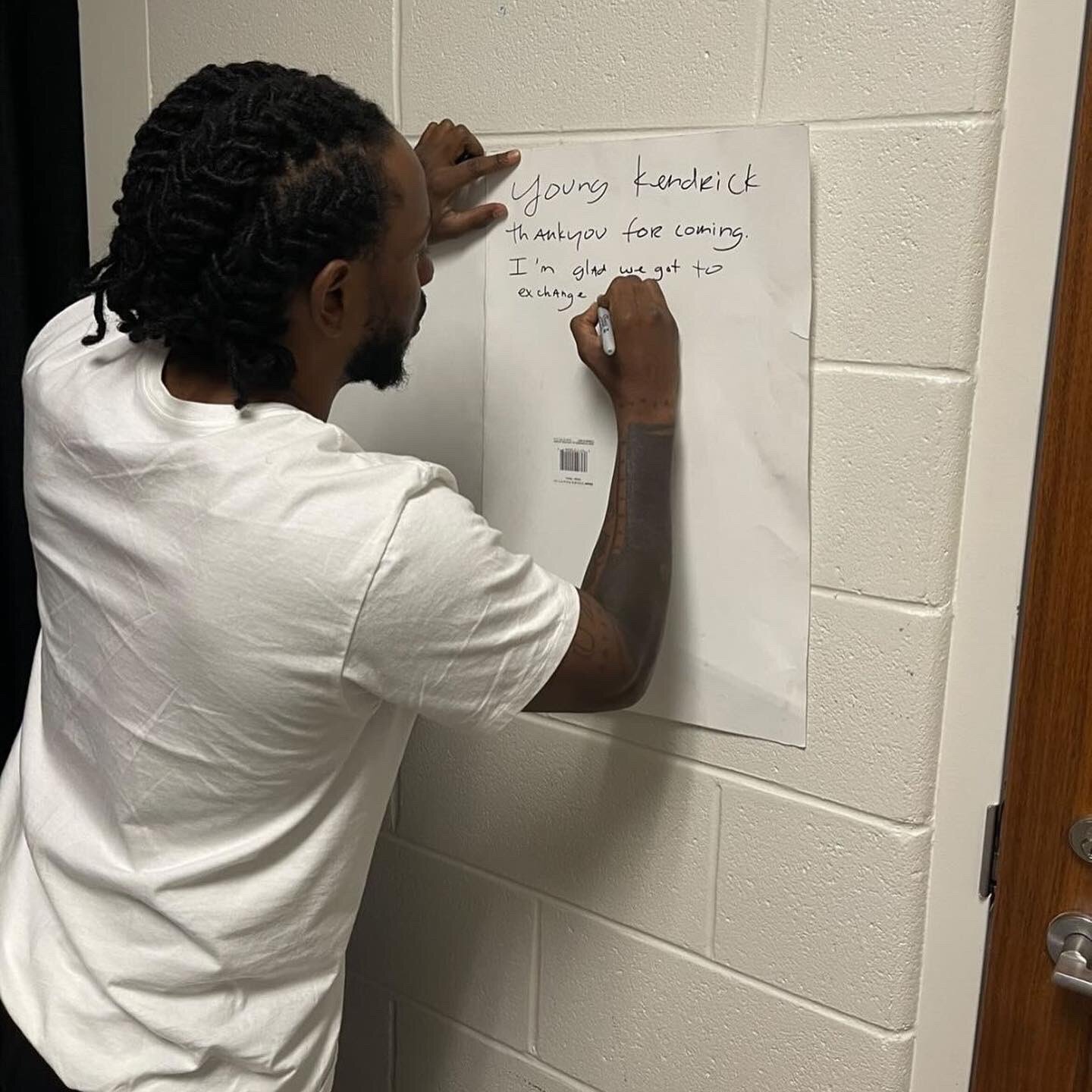 Kendrick Lamar Signing Young Kendrick's Poster
