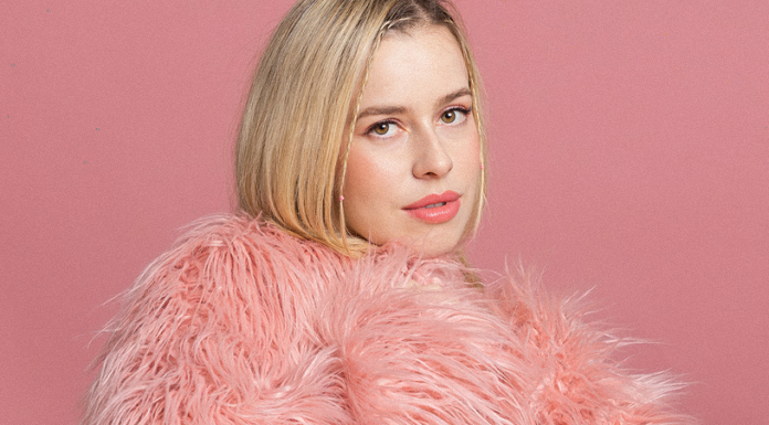 Alice Pisano’s New “Shimmering Pink” EP Alice Pisano in a pink coat on a pink background